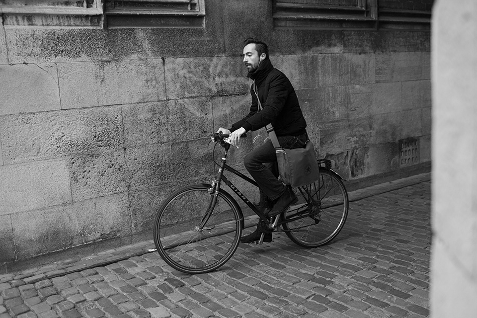 Cyclist beneath the Dom in Utrecht Cyclist beneath the Dom in Utrecht