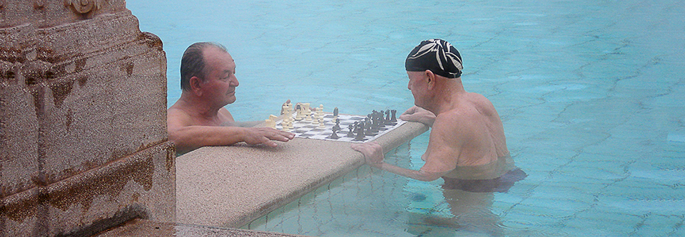 Men playing chess in Budapest bathhouse