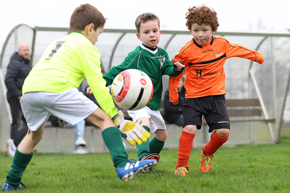 Children playing football Children playing football