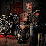 Motorcyclist with his motorbike, strobist style Motorcyclist with his motorbike, strobist style