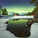 A photo of a red cabin in Norway every season